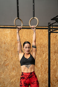 Young woman exercising in gym