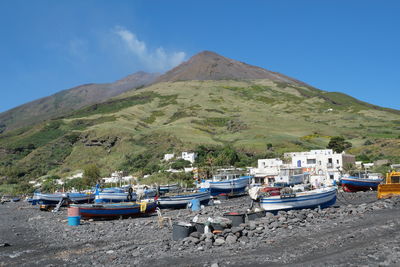 Boats moored at harbor