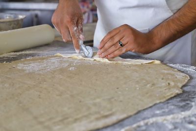 Midsection of man preparing food