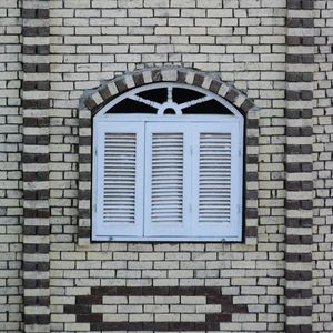 Close-up of window on brick wall