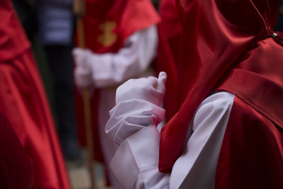 Person in traditional clothing marching on street