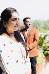 Young couple standing outdoors