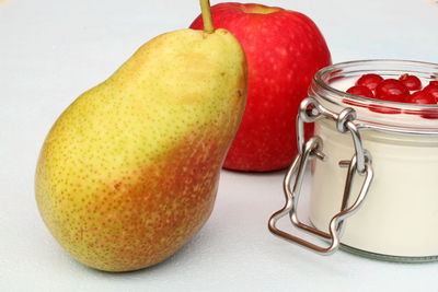 Close-up of fruits in jar on table