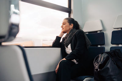 Woman sitting in bus