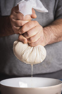 Close-up of man preparing food in kitchen