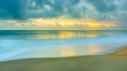 Scenic view of sea at sunset