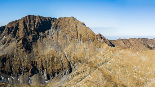 Panoramic view of rocky mountains against sky