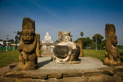 Statue of temple against building