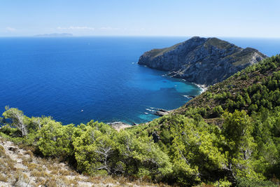 High angle view of sea and rocks against sky