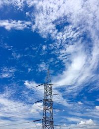 Low angle view of electricity pylon against sky