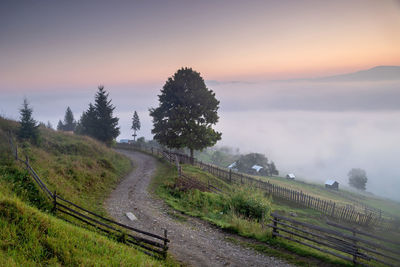 High angle view of mountain trail against sky during sunrise