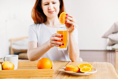 Young woman drinking glass with drink