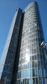 Low angle view of modern buildings against clear sky