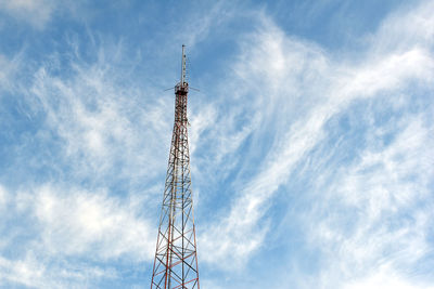 Low angle view of communications tower against sky