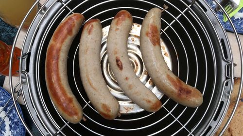 High angle view of meat on barbecue grill