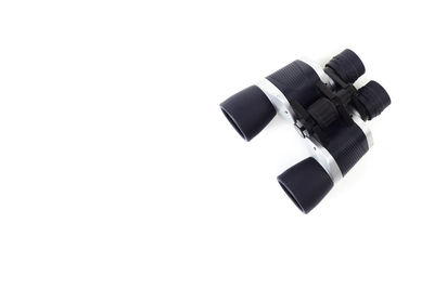 Close-up of camera over white background