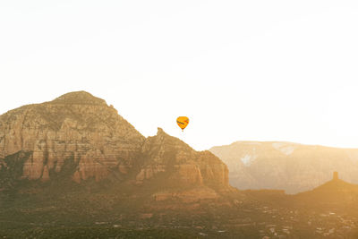 Hot air balloons against sky