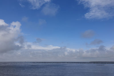 Scenic view of sea against blue sky