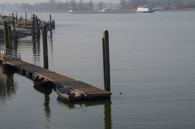 Wooden posts in lake