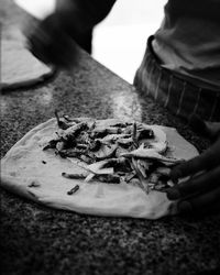 Low section of man holding food