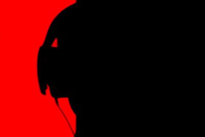 Close-up of red object over black background