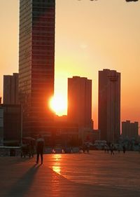 Silhouette of city at sunset