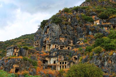 Low angle view of caves on rock formation