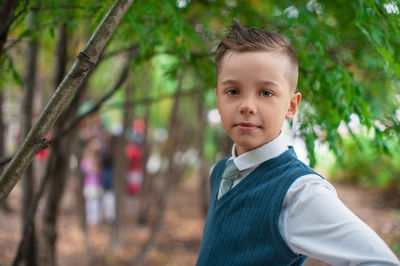 Portrait of young man standing outdoors