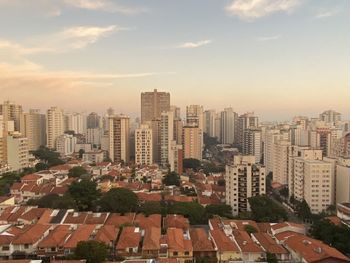 High angle view of buildings in city against sky