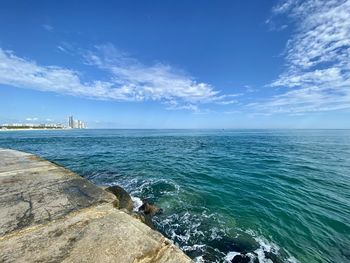 Scenic view of sea against blue sky