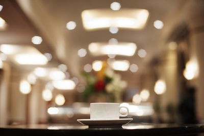 Close-up of coffee cup on table