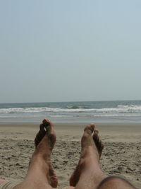 Low section of woman on beach