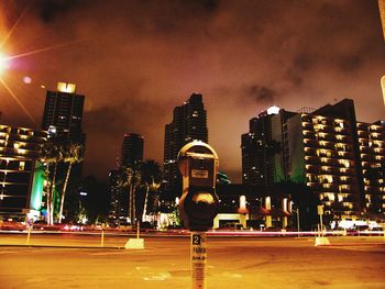 Illuminated city street at night