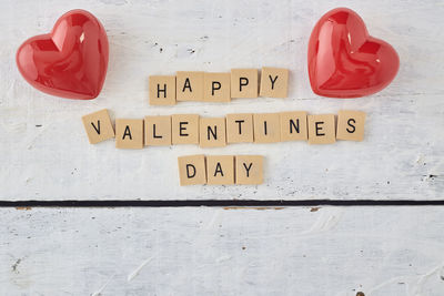 Close-up of heart shape sign on wood