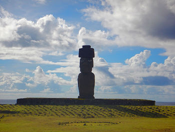 Built structure on field against sky