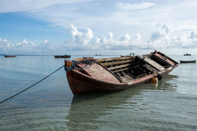 Boat in sea against sky