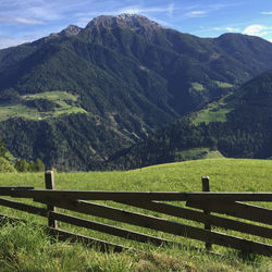 Scenic view of landscape and mountains against sky