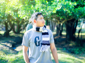 Full length of boy standing on tree