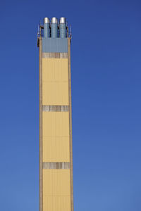 Low angle view of blue metal against sky