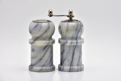 Close-up of objects on table against white background