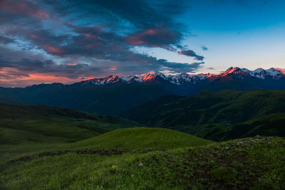 Scenic view of mountains against sky during sunset