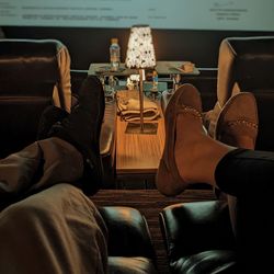 Low section of man sitting in bus