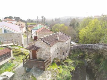 High angle view of old buildings against sky