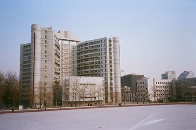 Modern buildings against clear sky in city