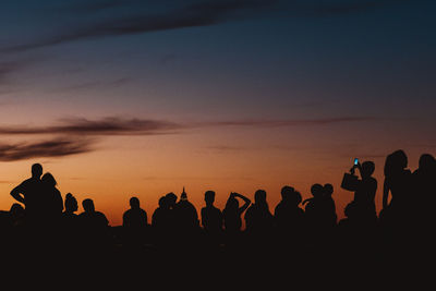 Silhouette people at sunset
