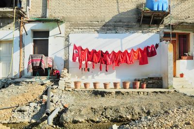 Clothes drying against buildings in city