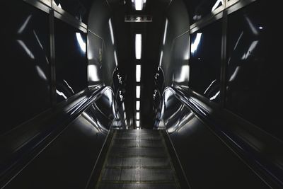 Low angle view of illuminated escalator