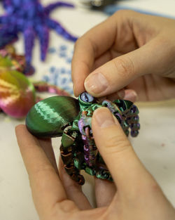 Cropped hand of person holding jewelry