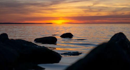 Scenic view of sea against sky during sunset