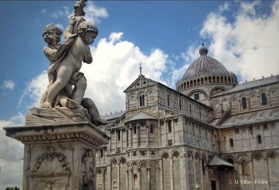 Low angle view of statue against cloudy sky